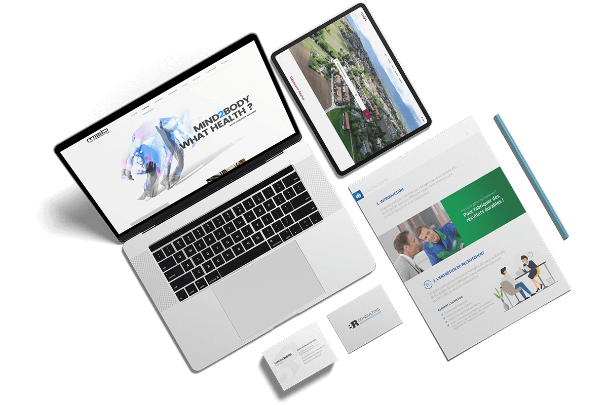 Ordinateur avec création de site, tablette avec site responsive, carte de visite et brochures réalisés par l'agence de communication igeneve